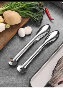 Close-up detail of two professional 304 stainless steel fish scalers in a kitchen