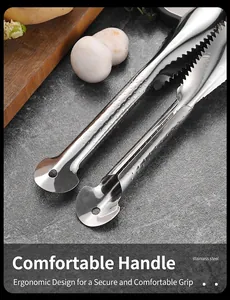 Close-up view of a professional stainless steel fish scale scraper ergonomic handle