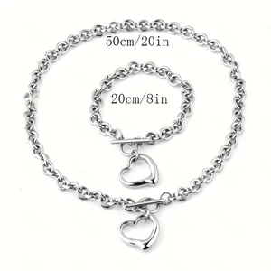Detailed view of silver stainless steel heart necklace and bracelet set with dimensions