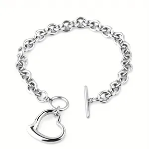 Detail of chunky stainless steel chain necklace with hollow heart pendant and OT buckle.