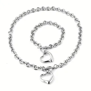 Detailed view of titanium steel chain set with hollow heart pendants and OT buckles