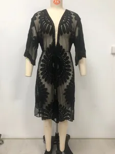 Elegant black lace embroidered kimono beach cover-up displayed on a white mannequin.