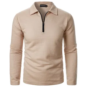 Close-up detail of a beige men's waffle knit half-zip pullover shirt with a polo collar