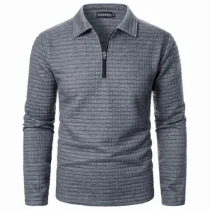 Frontal detail of a men's grey waffle knit half-zip sweater with a polo collar