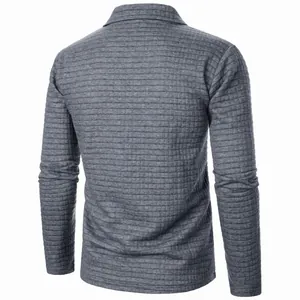 Detailed back view of grey waffle knit long sleeve jacket showing textured fabric