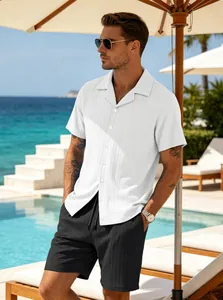 Men's casual summer resort set featuring a white ribbed shirt and black shorts on vacation