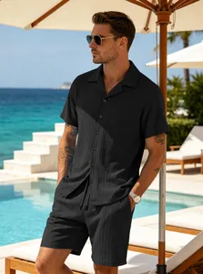 Men's black ribbed short-sleeved shirt and shorts set styled for a summer resort