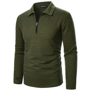Dark green men's waffle-knit sweatshirt featuring half-zip design and classic lapel collar