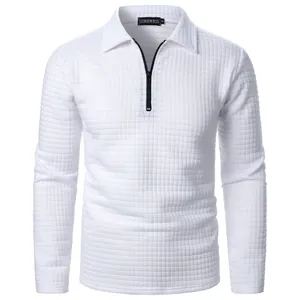 Close-up of white waffle knit texture and black half-zip detail on men's pullover
