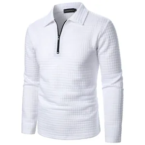 Close-up of white waffle texture men's long sleeve polo shirt with half-zip design