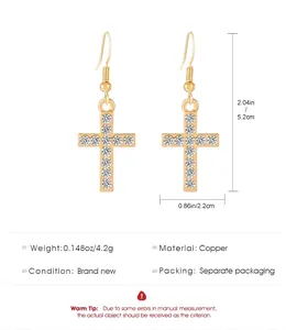 Detail view of gold-plated cross earrings with zirconia and product dimensions.