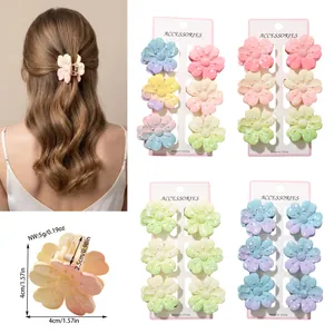 Detailed product view of colorful flower hair claw clips with size and weight measurements