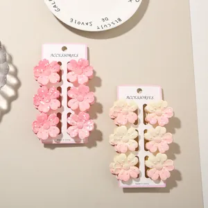 Elegant set of colorful plumeria flower hair claw clips with matte finish for women