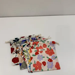 Set of portable floral drawstring storage pouches for makeup and small accessories