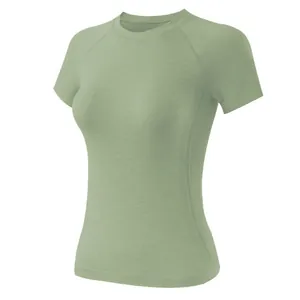 Close-up detail of women's slim-fit breathable yoga T-shirt in light sage green