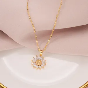 Detailed close-up of a vintage golden sunflower necklace with zirconia petals.