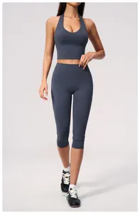 Detail of grey-blue high waist yoga set with halter sports bra and capris