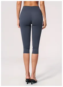 Back view of high-waist tight yoga capri pants for women in brushed dark grey fabric