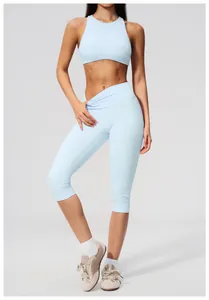 Detailed view of light blue brushed high-waisted yoga capris and matching sports bra