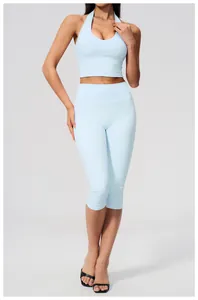 Front view of light blue yoga set with halter top and high-waisted cropped leggings