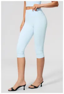 Side view of light blue high-waisted brushed yoga capris for fitness and running