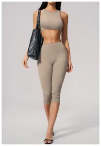 Front view of women's beige brushed high waist yoga capri pants and matching bra set