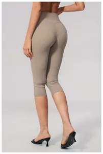 Back view detail of high-waisted brushed yoga capris showing slim fit and soft fabric
