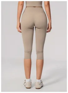 High waist slimming yoga capris in khaki shown from the back view