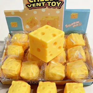 Square yellow realistic cheese squeeze vent toy stress ball shown in a retail display box
