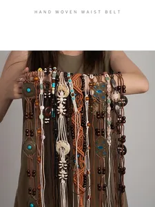 Detailed view of multiple handmade bohemian woven waist belts with beads and shells