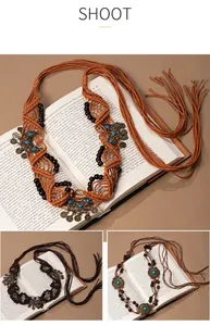 Handmade bohemian retro woven waist chain with tassels and turquoise beads details.