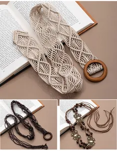 Detail view of handmade bohemian braided belts with wooden beads and charms