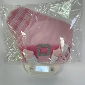 Pink sequined cartoon Christmas stocking gift bag weighing 102.8g on a digital scale