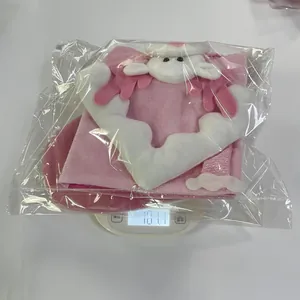 Macro shot of a pink cartoon Christmas stocking being weighed for accurate shipping.