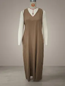 Casual brown cotton linen sleeveless maxi dress with V-neck and pockets on mannequin