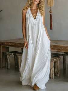 Detailed view of the relaxed cotton linen white maxi dress with functional side pockets.
