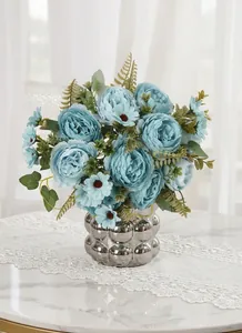 Detailed macro view showing the realistic texture of blue artificial peony flowers