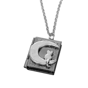 Vintage silver book locket necklace featuring moon and cat pendant for memorial photos