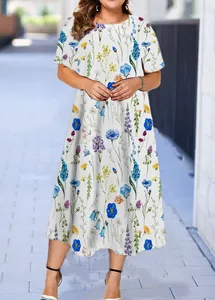 Summer midi dress featuring vibrant blue and yellow floral patterns on white fabric