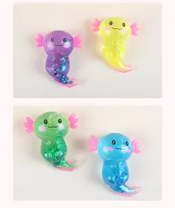 Close-up of four glittery axolotl squishy toys in purple, yellow, green, and blue
