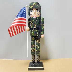 Detailed 38cm wooden soldier nutcracker in camouflage uniform holding a US flag and rifle