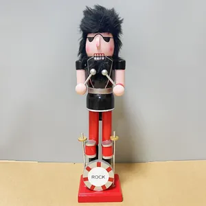 Detailed view of a 38cm wooden rocker nutcracker figurine with a mini drum set