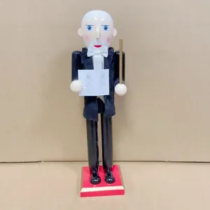 Detailed view of a 38cm wooden conductor nutcracker ornament wearing a black tuxedo