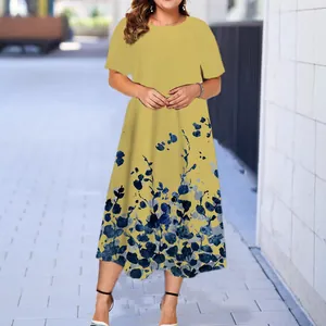 Summer casual yellow short-sleeved midi dress featuring a blue botanical floral print