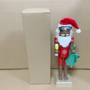 Detail view of 38cm wooden Santa nutcracker soldier standing next to a cardboard box