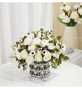 Elegant artificial white peony and daisy bouquet in a silver bubble vase for home decor