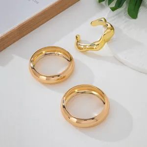 Chunky 3-piece gold-tone bracelet set with irregular open design and minimalist bands