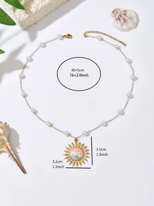 Detailed view of ocean-themed gold necklace with sun pendant and size annotations.