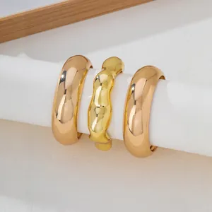 Set of 3 minimalist polished gold chunky bangles with irregular wave design for stacking