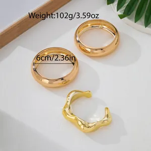 Minimalist set of 3 luxury gold-tone stackable bangles with irregular open design